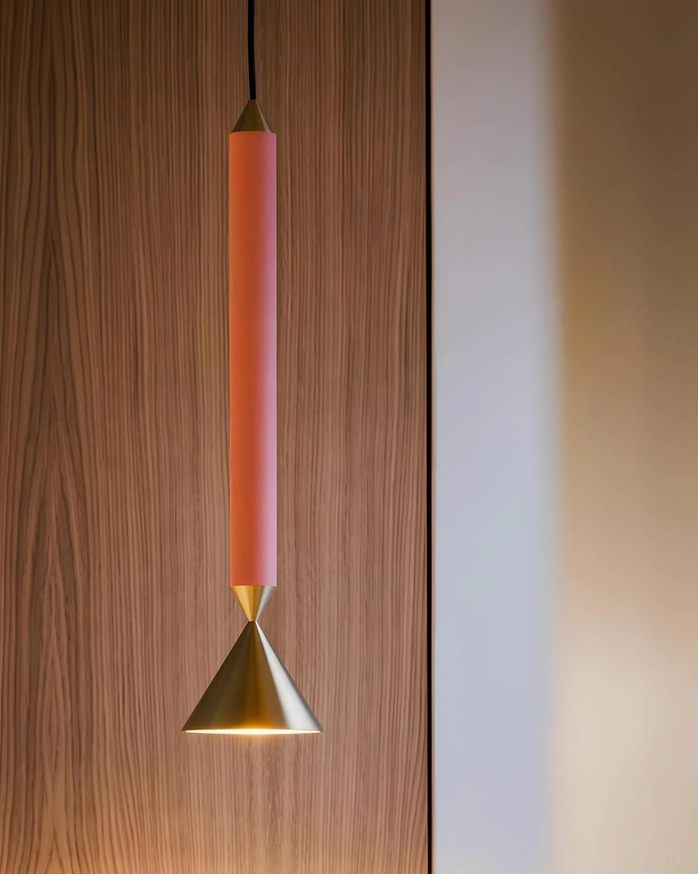 Terracotta Pylon pendant with gold cone base mounted on wooden panel wall, warm downward lighting ambiance