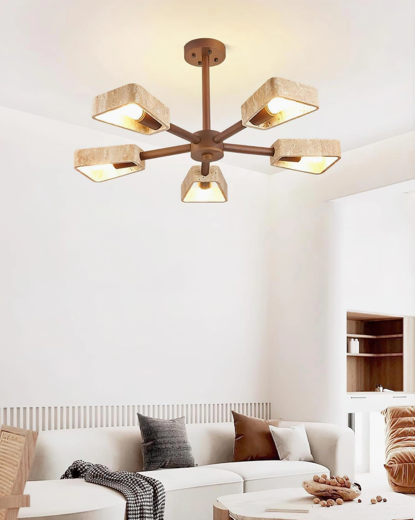 Quadra travertine chandelier in modern living room interior at eye level with warm neutral decor