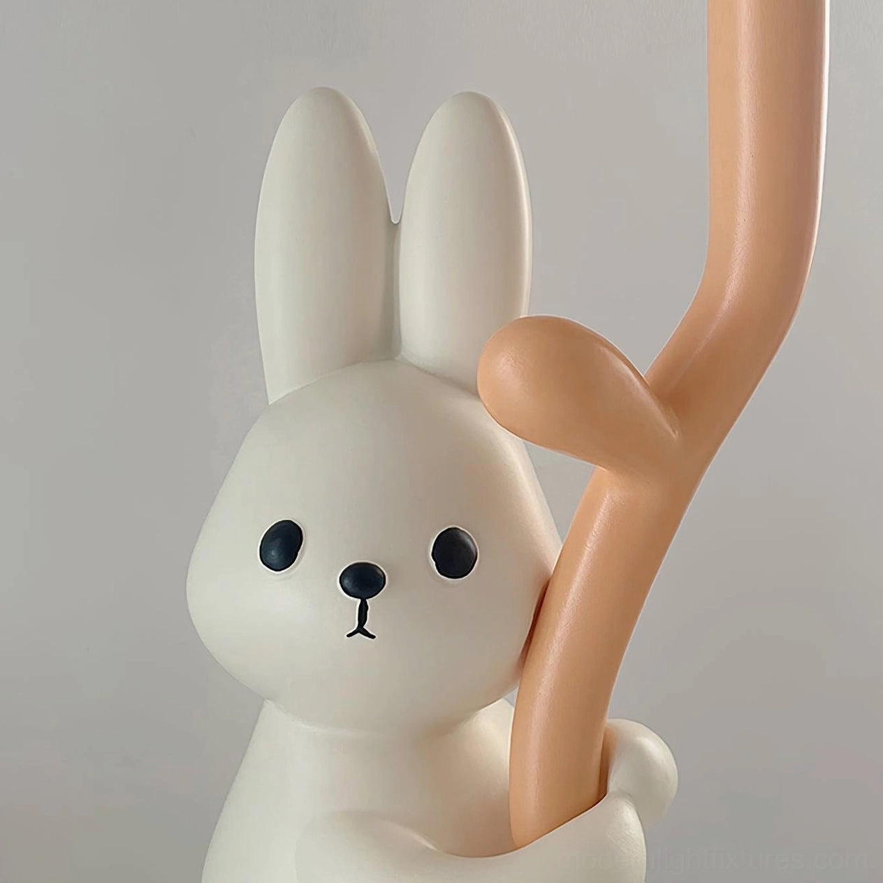 Close-up macro detail of rabbit hug lamp face and pole connection