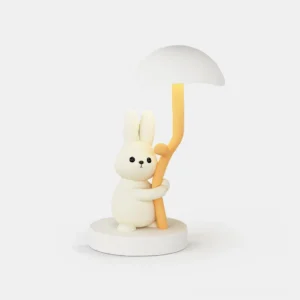 Front view of cute rabbit hug LED table lamp with matte white finish on plain background