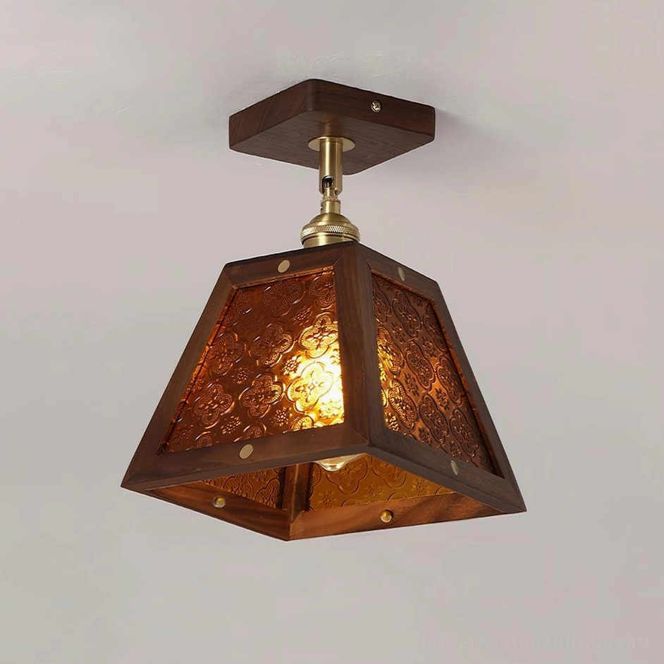 Radia stained glass ceiling lamp with brown textured glass, warm glowing light, and dark wood frame
