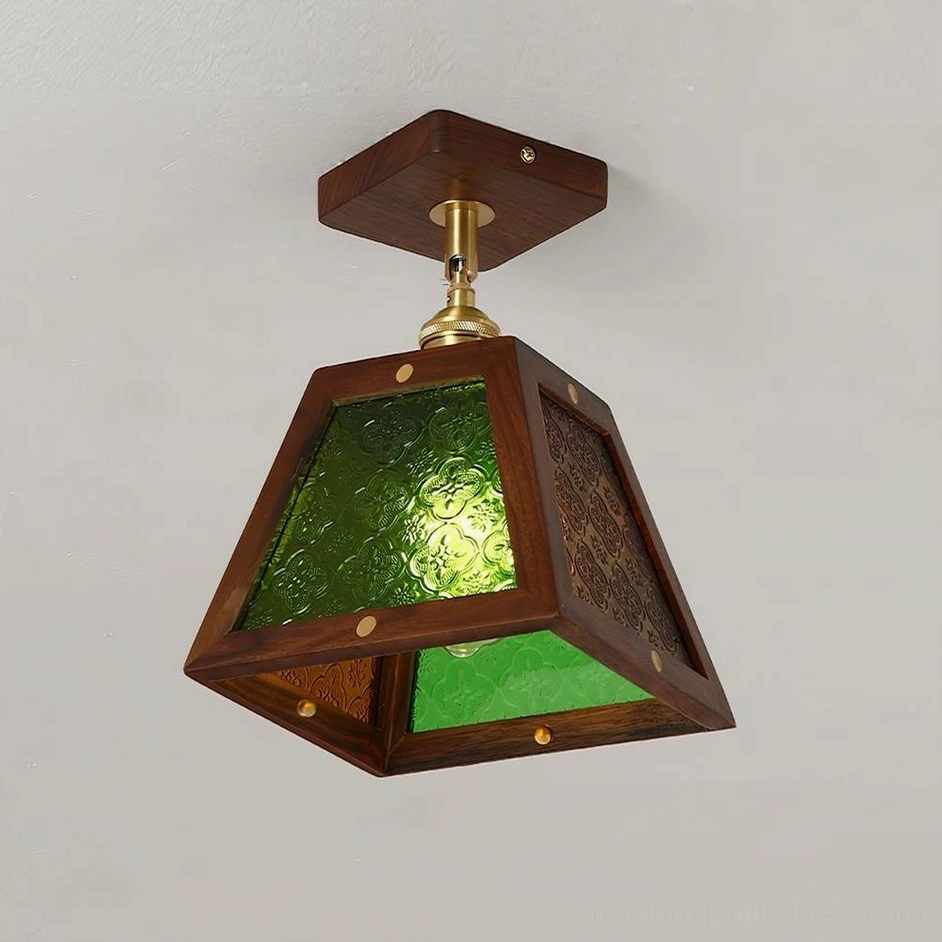 Radia ceiling lamp three-quarter side view showing green patterned glass panels and brass connecting joint