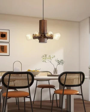 Radia 6-head wood pendant light hanging over modern dining table with warm Edison bulbs creating ambient lighting