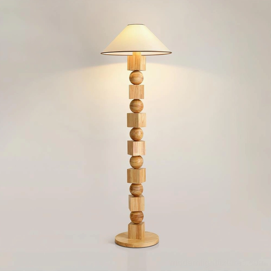 Light natural wood Radian sculptural floor lamp with smooth wooden sphere base and beige fabric shade shown from front flat perspective against white studio background