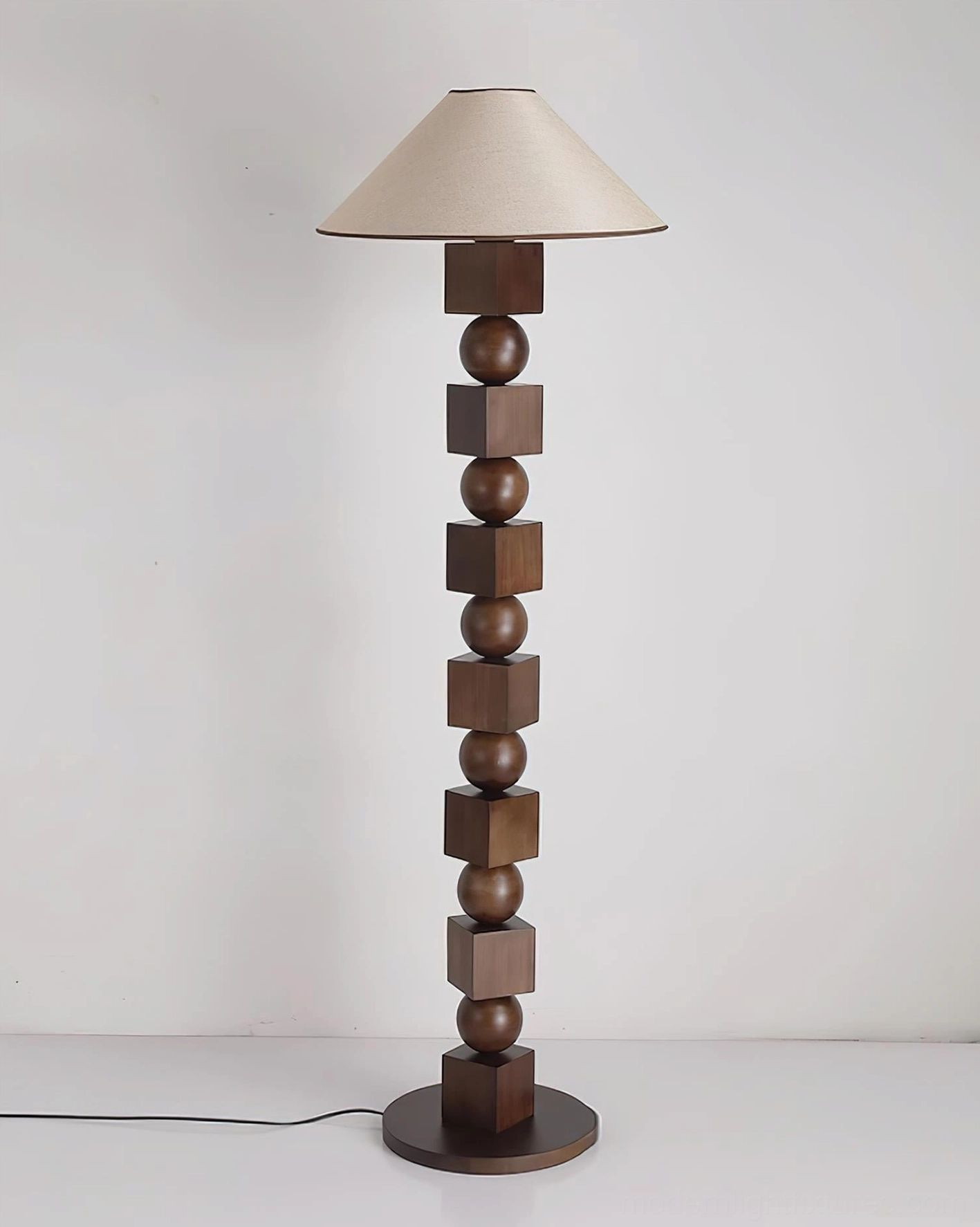 Radian sculptural wooden floor lamp styled in modern interior design setting showcasing how the geometric design complements contemporary home decor