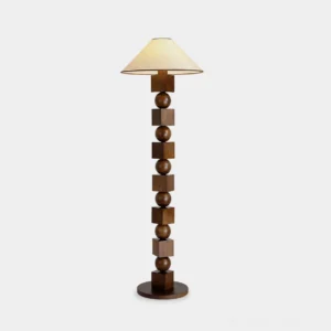 Radian sculptural wooden floor lamp with alternating wood spheres and cubes in walnut finish, shown from front perspective against white studio background with beige fabric shade