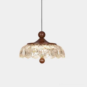 Radiant crystal pendant light with faceted acrylic shade and walnut wood top, front view against white background