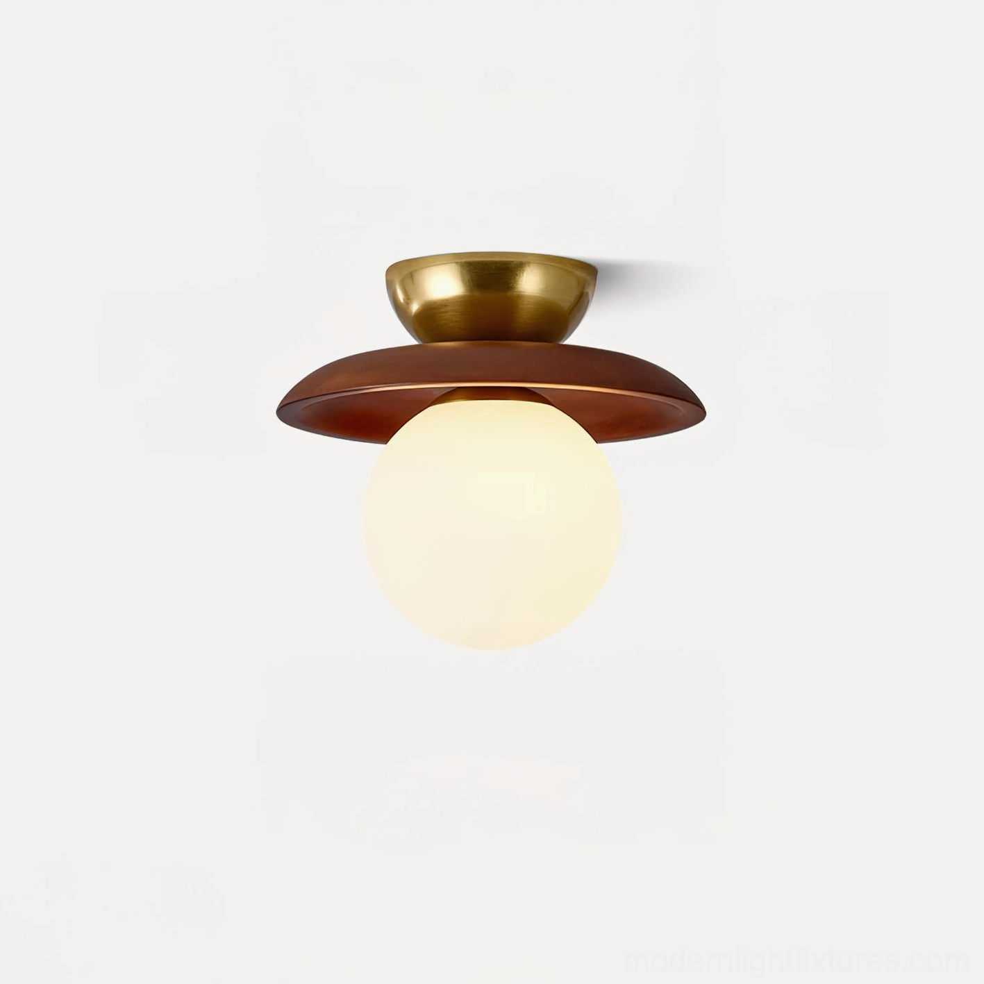 Radiora semi-flush ceiling lamp illuminated, showing warm glow through frosted glass sphere