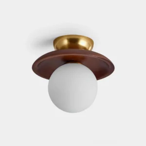 Radiora mid-century modern globe ceiling light with brass canopy and frosted opal glass shade, overhead studio view