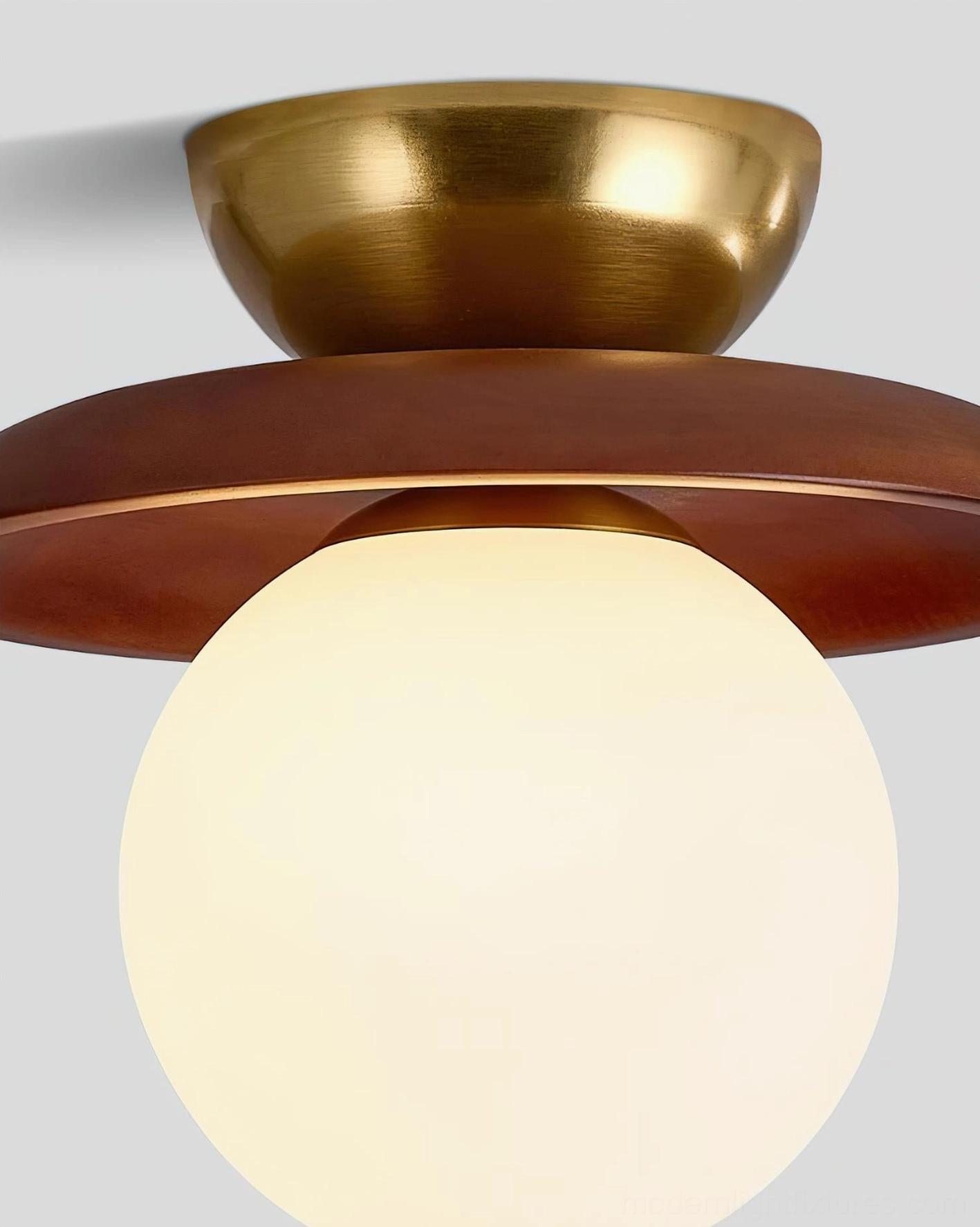 Radiora globe ceiling lamp showing metal canopy, wood tray, and frosted glass sphere construction
