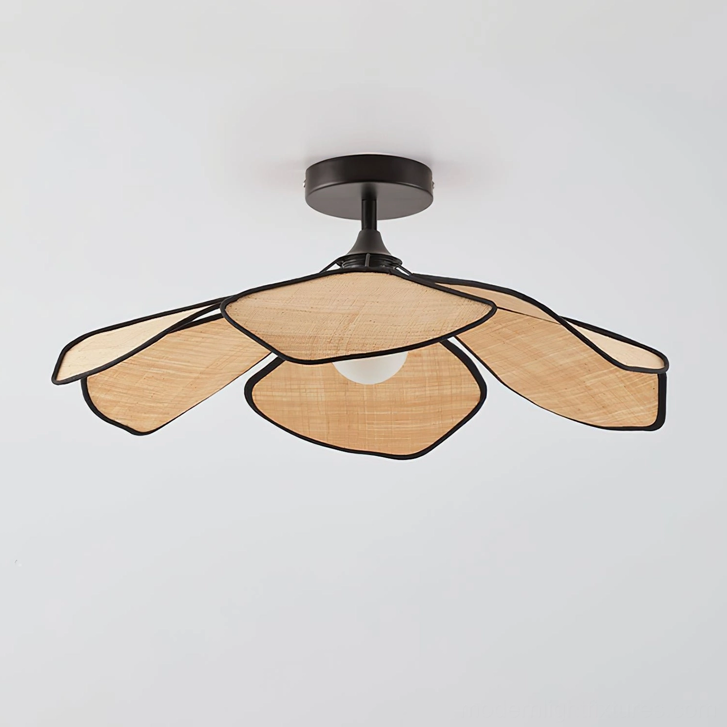 Natural beige raffia petal ceiling light with black metal hardware and frame, angled front view showcasing woven texture and construction details