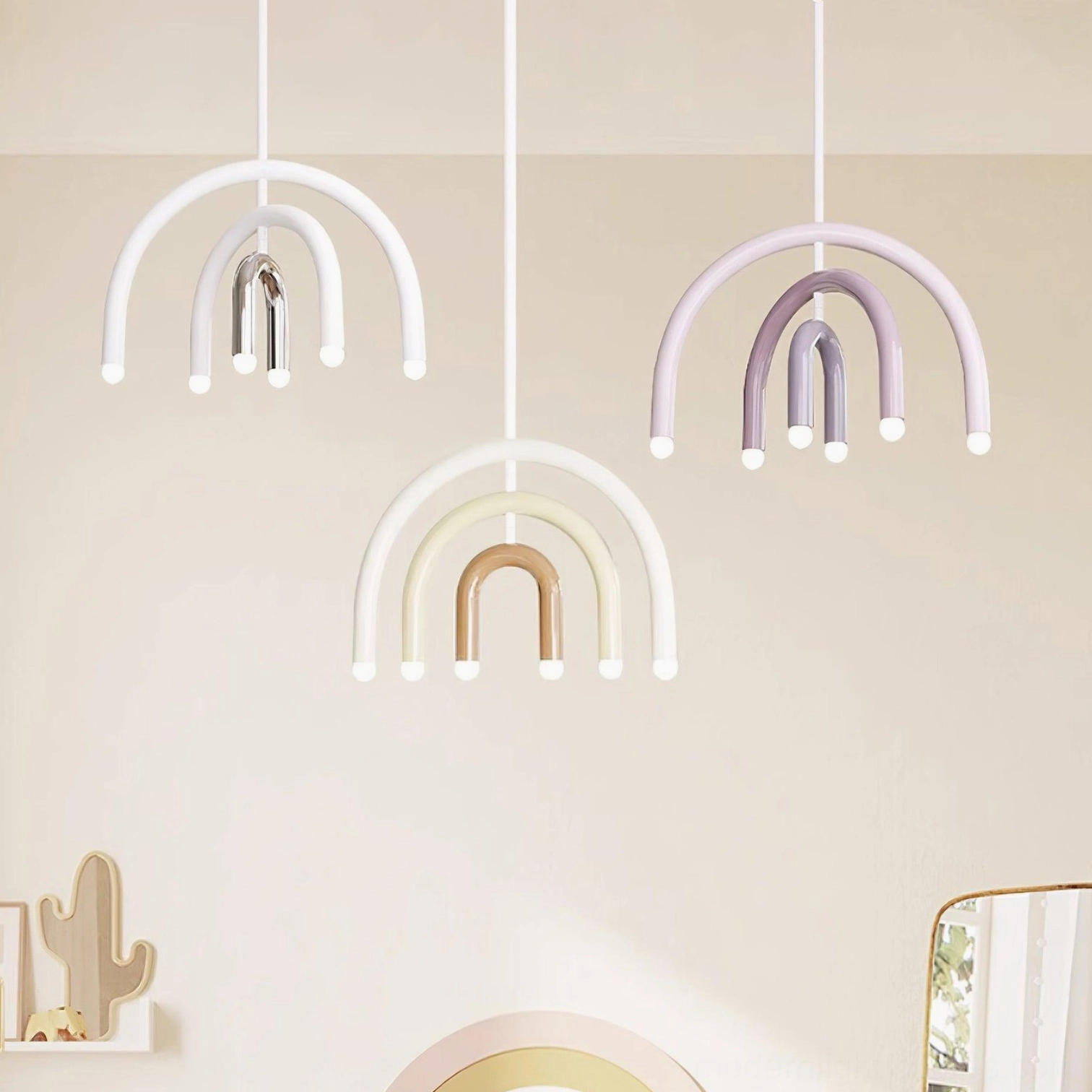 Multiple rainbow arc pendant lights displayed in color options white cream light purple nursery