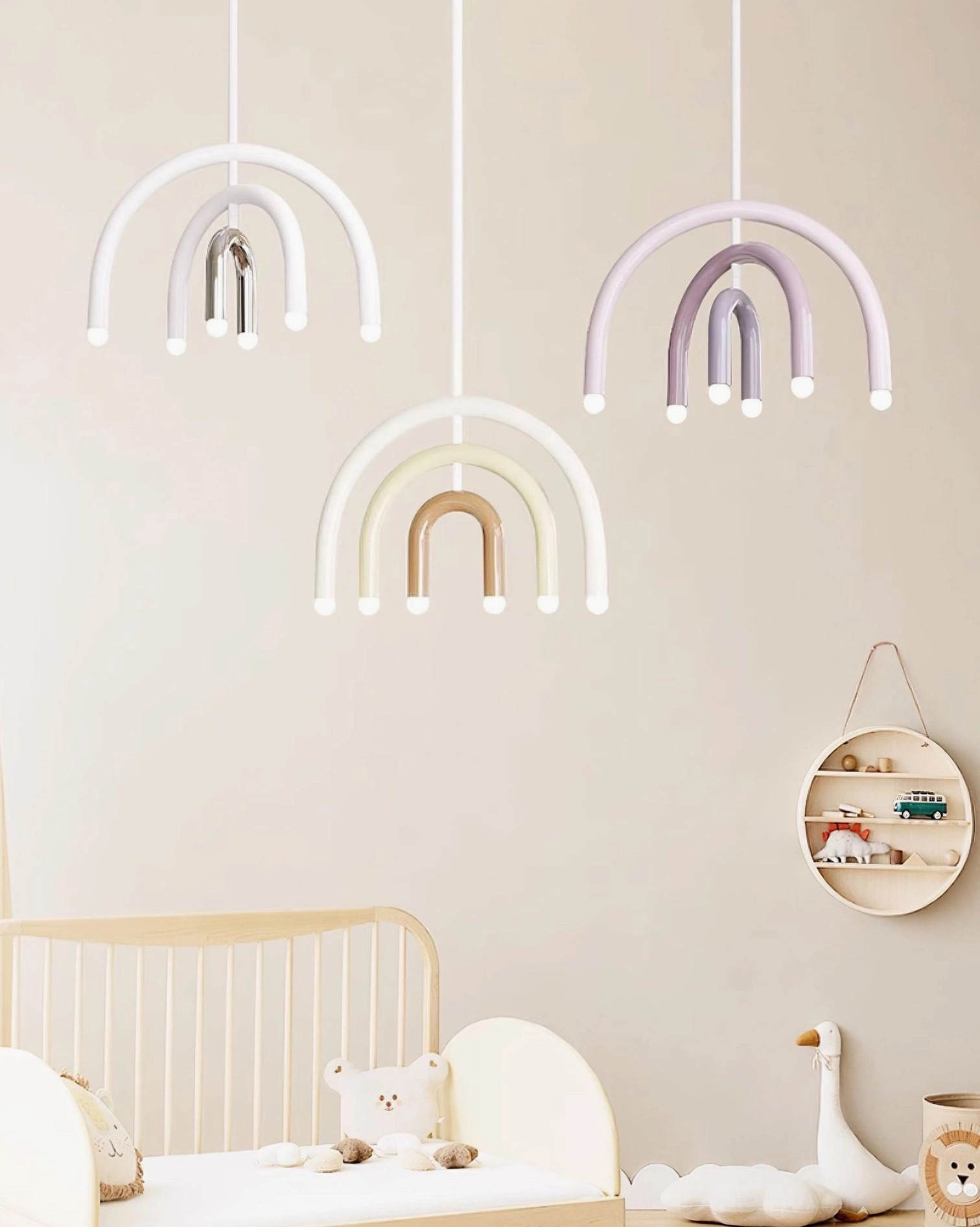 Set of rainbow arc pendant lamps in multiple colors for children's playroom and nursery