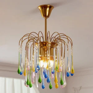 Rainlight chandelier three-quarter perspective showing interior E14 bulbs and suspended glass teardrop design