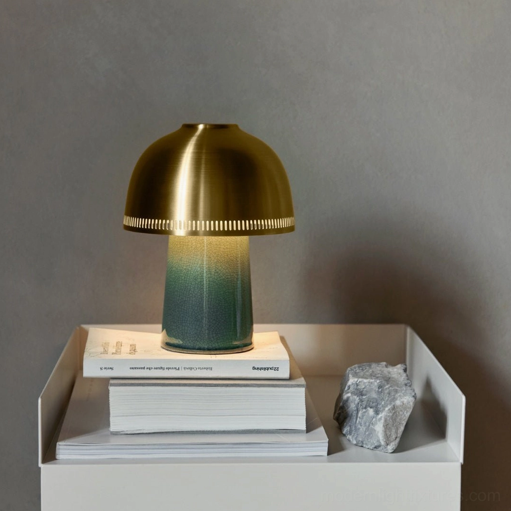 Raku handcrafted ceramic table lamp displayed on minimalist bedside with stacked books and gradient teal base