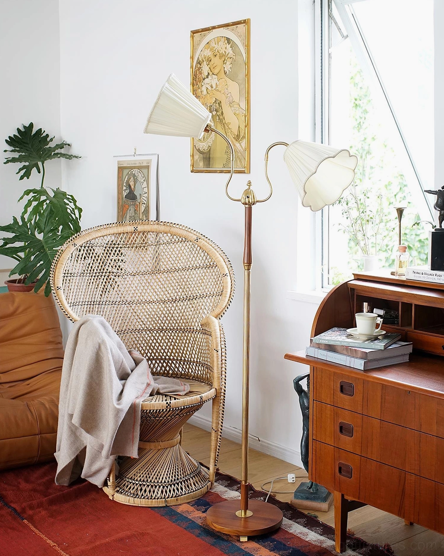 Ramira mid-century modern floor lamp providing ambient lighting in vintage-styled living room with bohemian décor