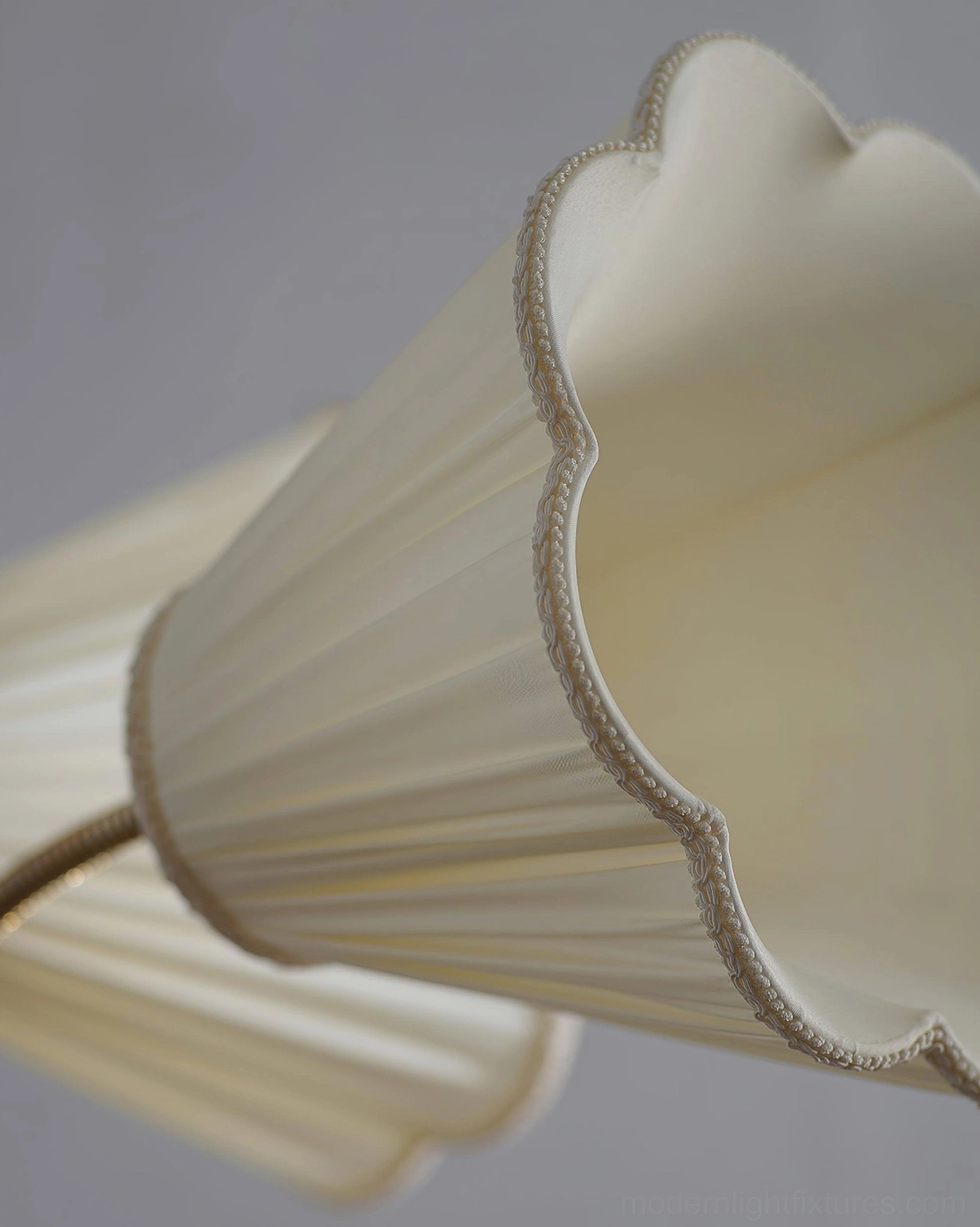 Ramira floor lamp details showing handcrafted brass joints and wood accent integration