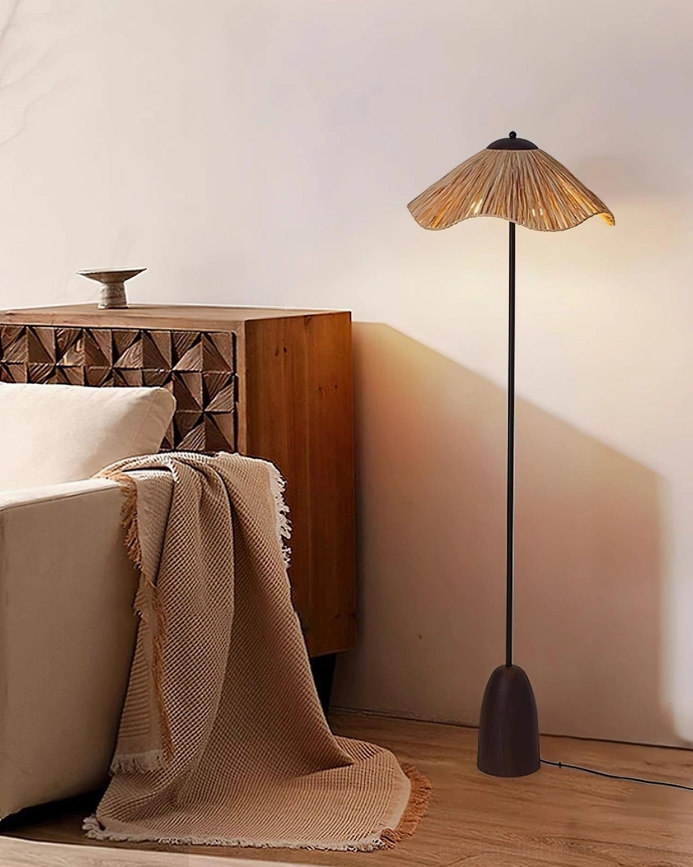 Rania floor lamp in casual living room corner with draped throw blanket and relaxing seating area