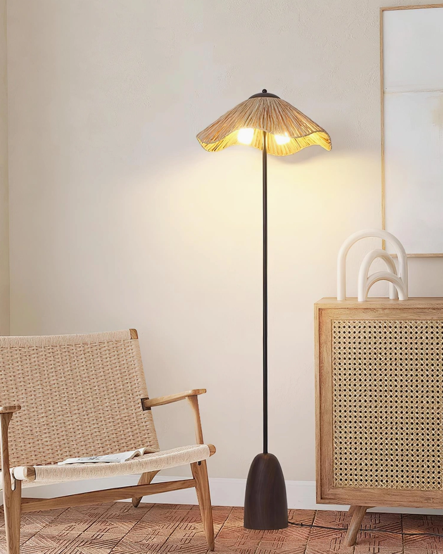 Rania natural raffia floor lamp paired with rattan woven furniture and cozy seating nook