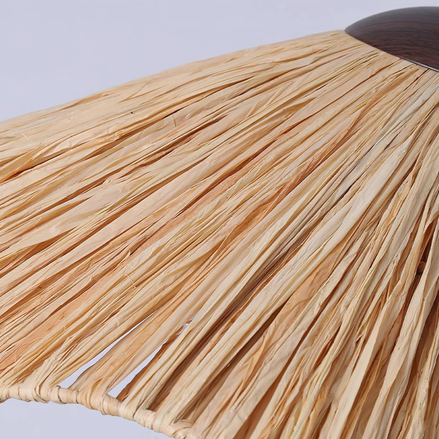 Rania natural raffia floor lamp demonstrating soft diffused glow and wabi-sabi design philosophy