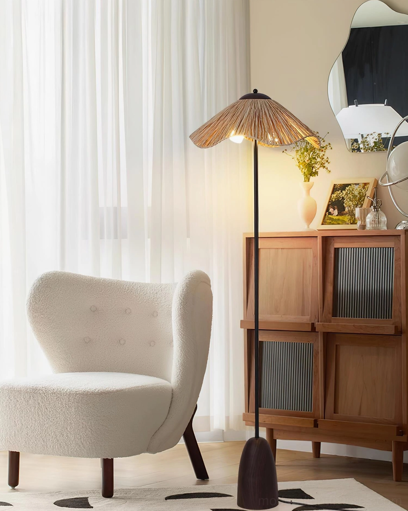 Rania natural raffia floor lamp ambient lighting effect creating warm shadows in interior space