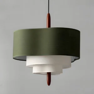 Close-up detail of Raphia 5-head pendant light showing layered fabric construction and brown wooden suspension rod