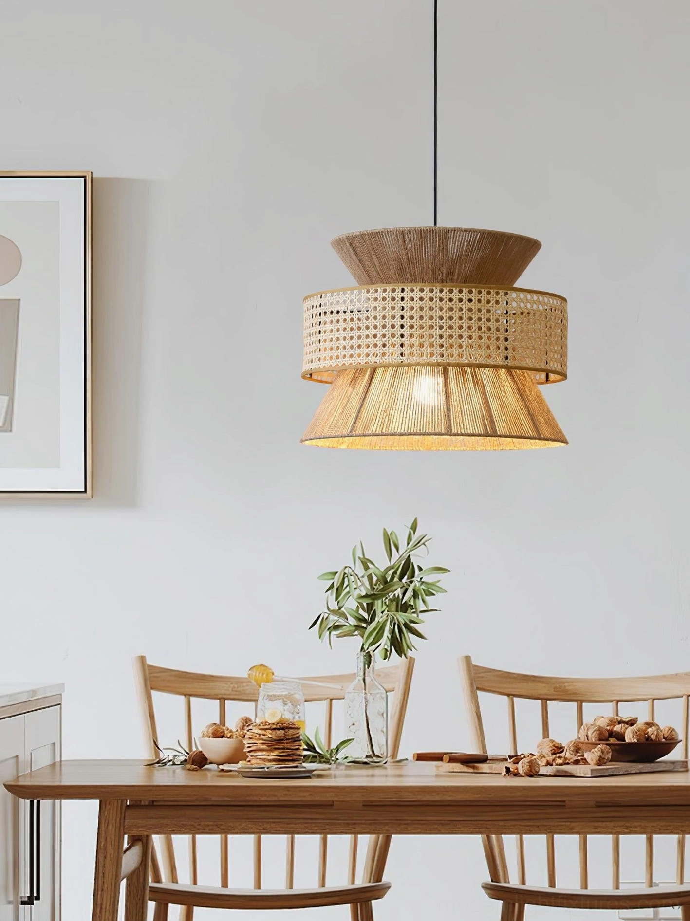 Rattan bamboo pendant light fixture in bedroom space with soft warm illumination and comfort