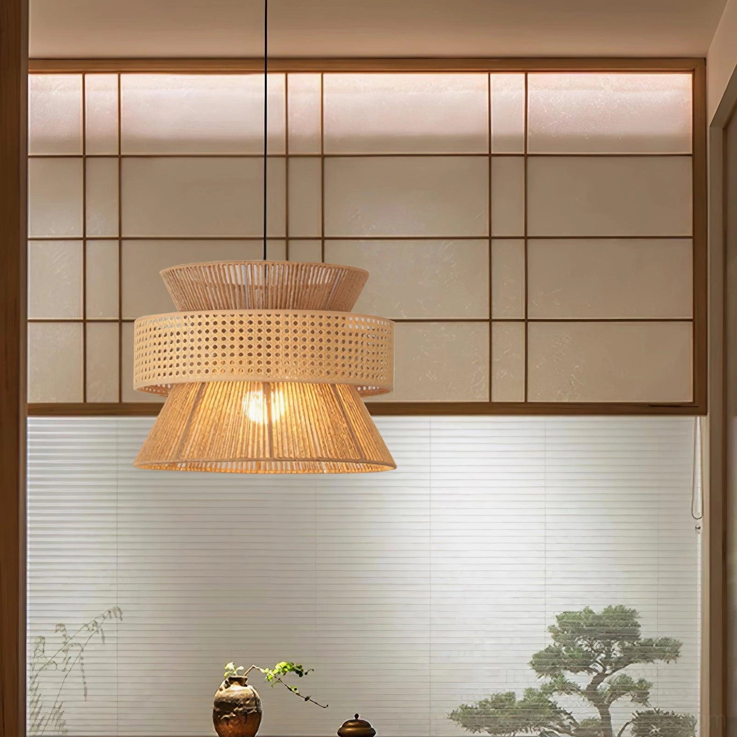 Rattan bamboo pendant light illuminated showing warm color temperature and diffused glow