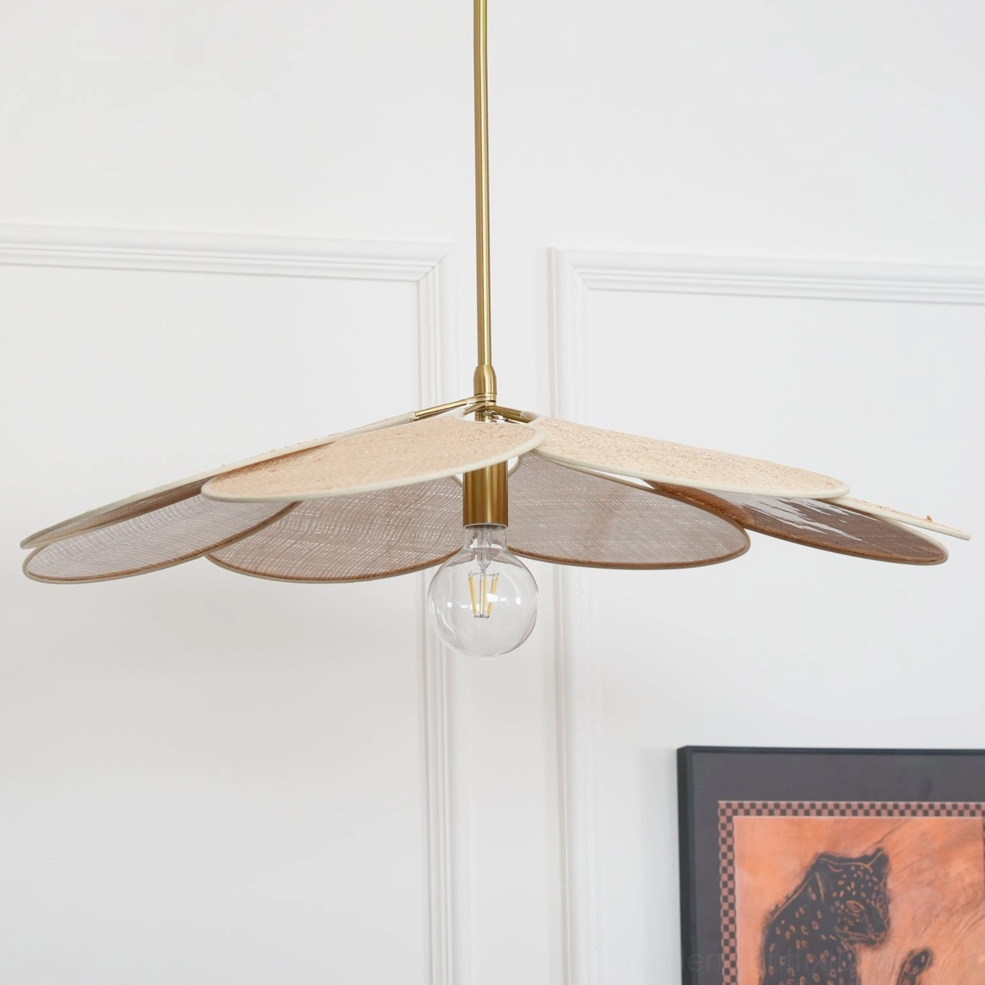 Rattan bloom pendant light installation detail showing woven petal layers and light diffusion