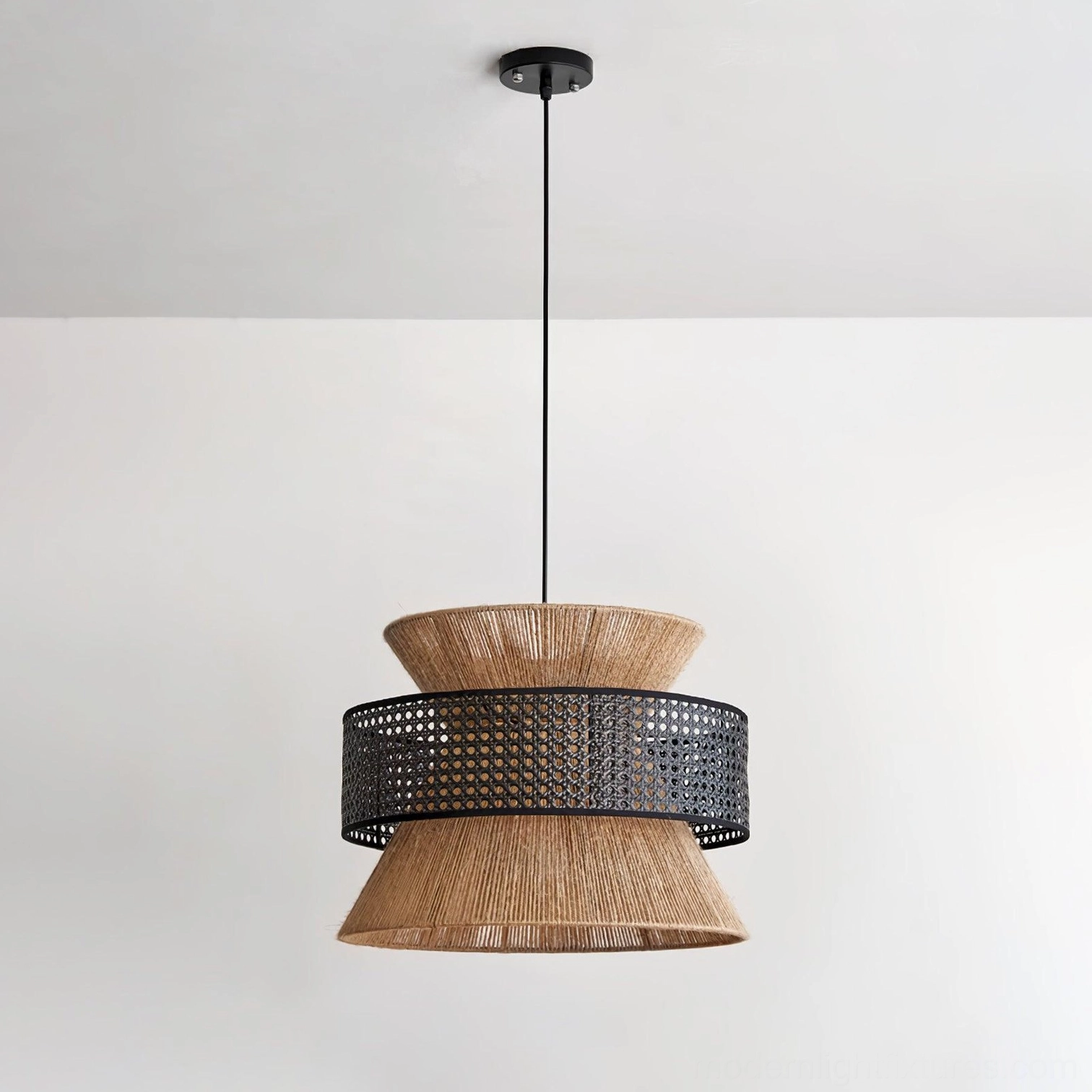 Rattan boho pendant lamp hanging in styled interior with warm ambient lighting and shadow play