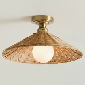 Natural rattan woven shade ceiling fixture with brass metal base - detailed texture view