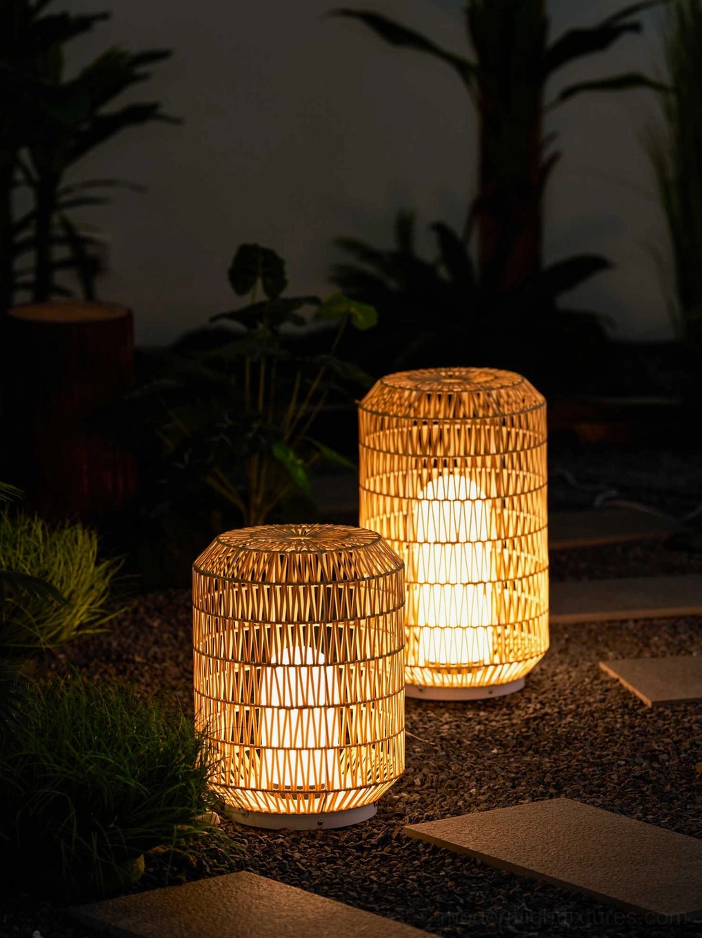 Woven rattan outdoor lamp on deck or patio creating warm boho lighting ambiance