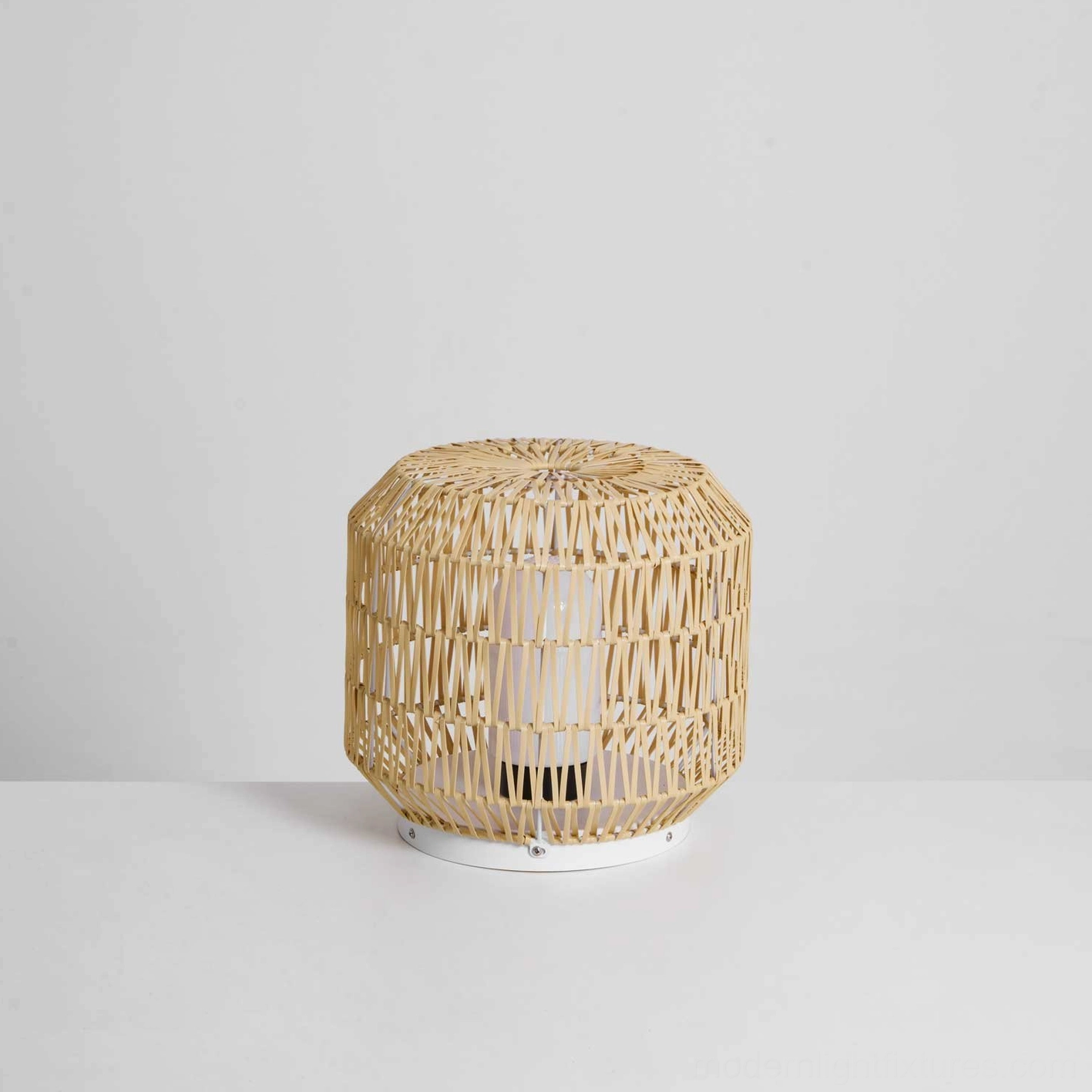 Modern rattan outdoor table lamp styled in minimalist contemporary garden setting