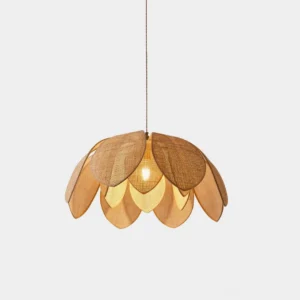 Rattan lotus pendant light with hand-woven petal design shown in studio setting