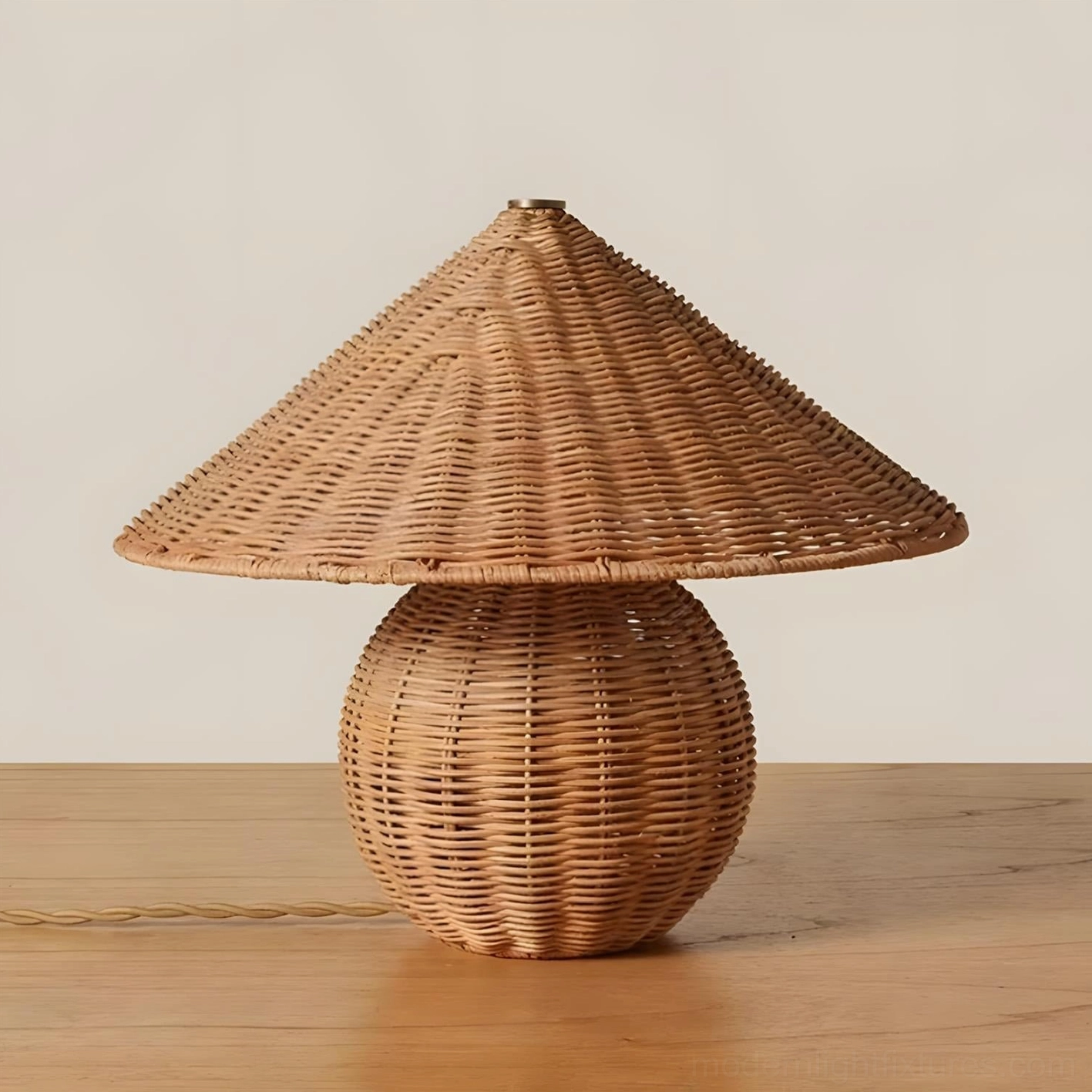 Natural rattan mushroom table lamp on wooden surface with exposed power cord, eye-level perspective showing soft filtered light through woven shade