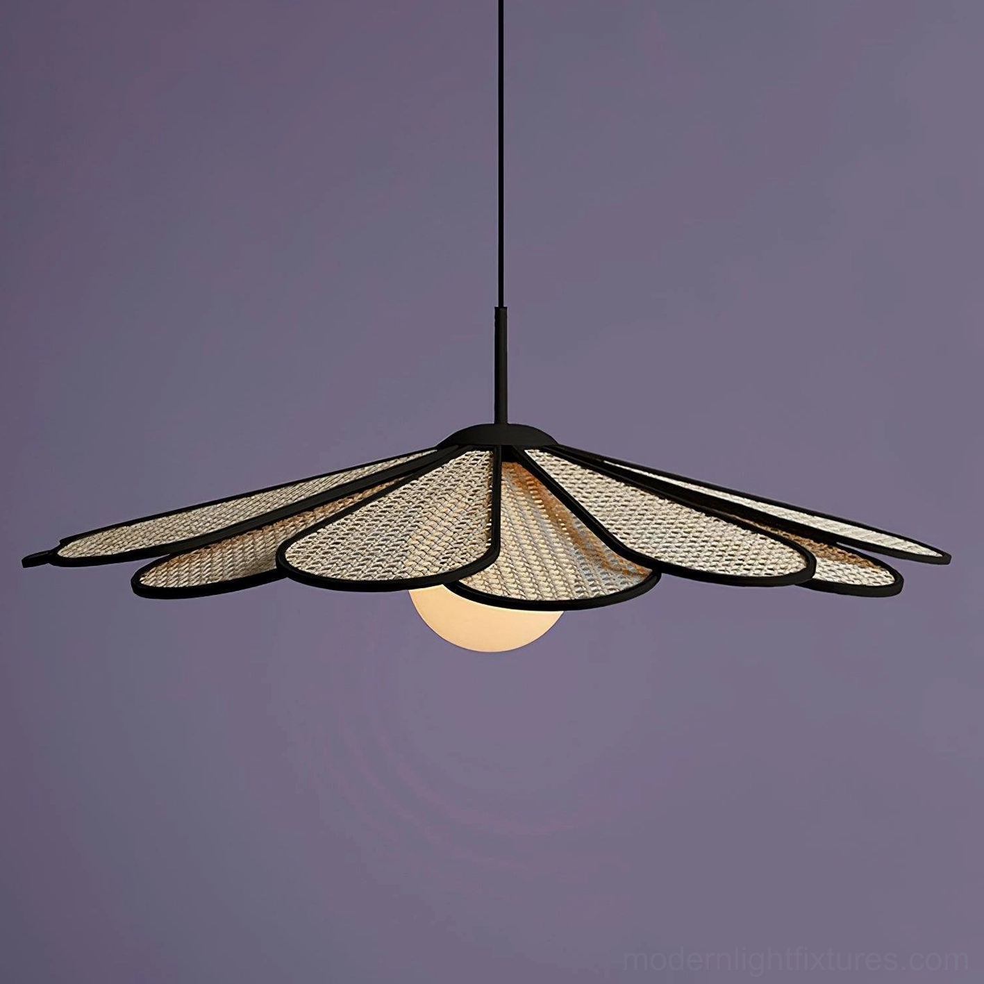 Tropicana rattan pendant fixture displaying warm diffused illumination and botanical silhouette in living space