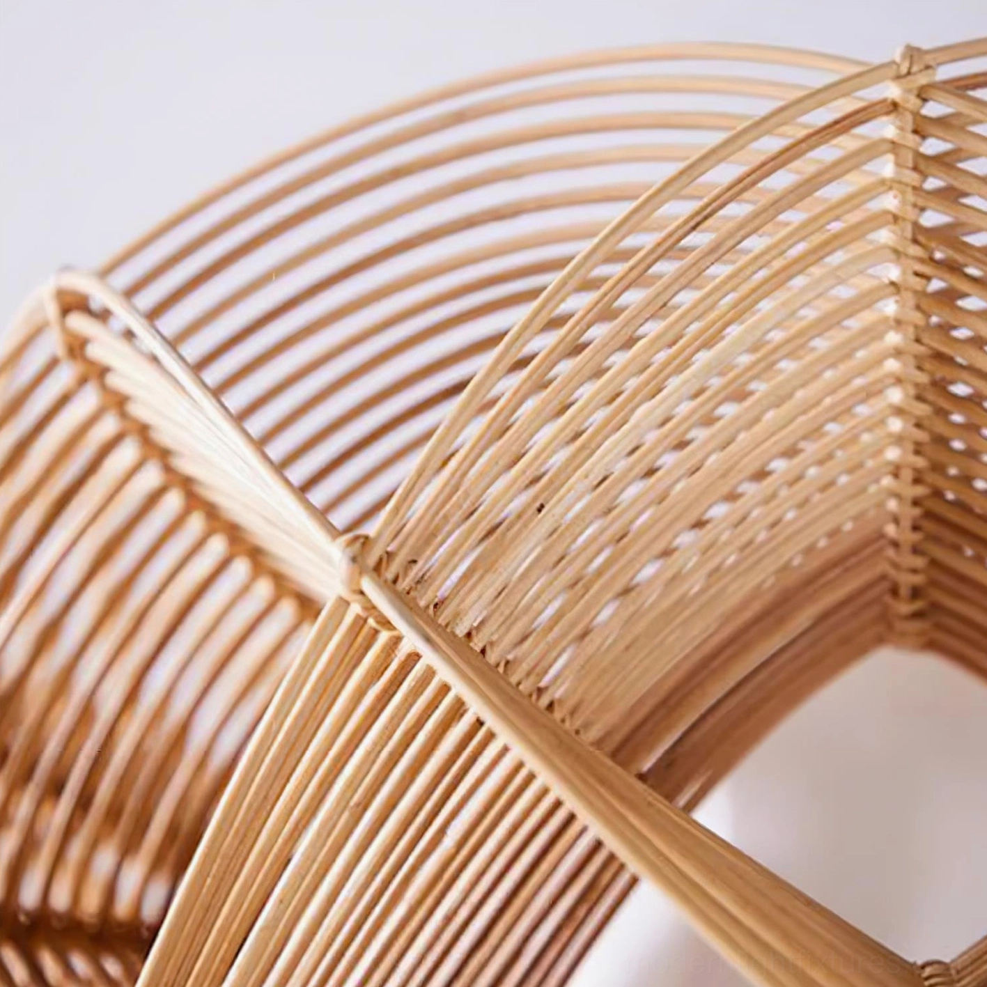 Handcrafted rattan pendant lamp detail shot highlighting artisanal weaving pattern and metal frame construction