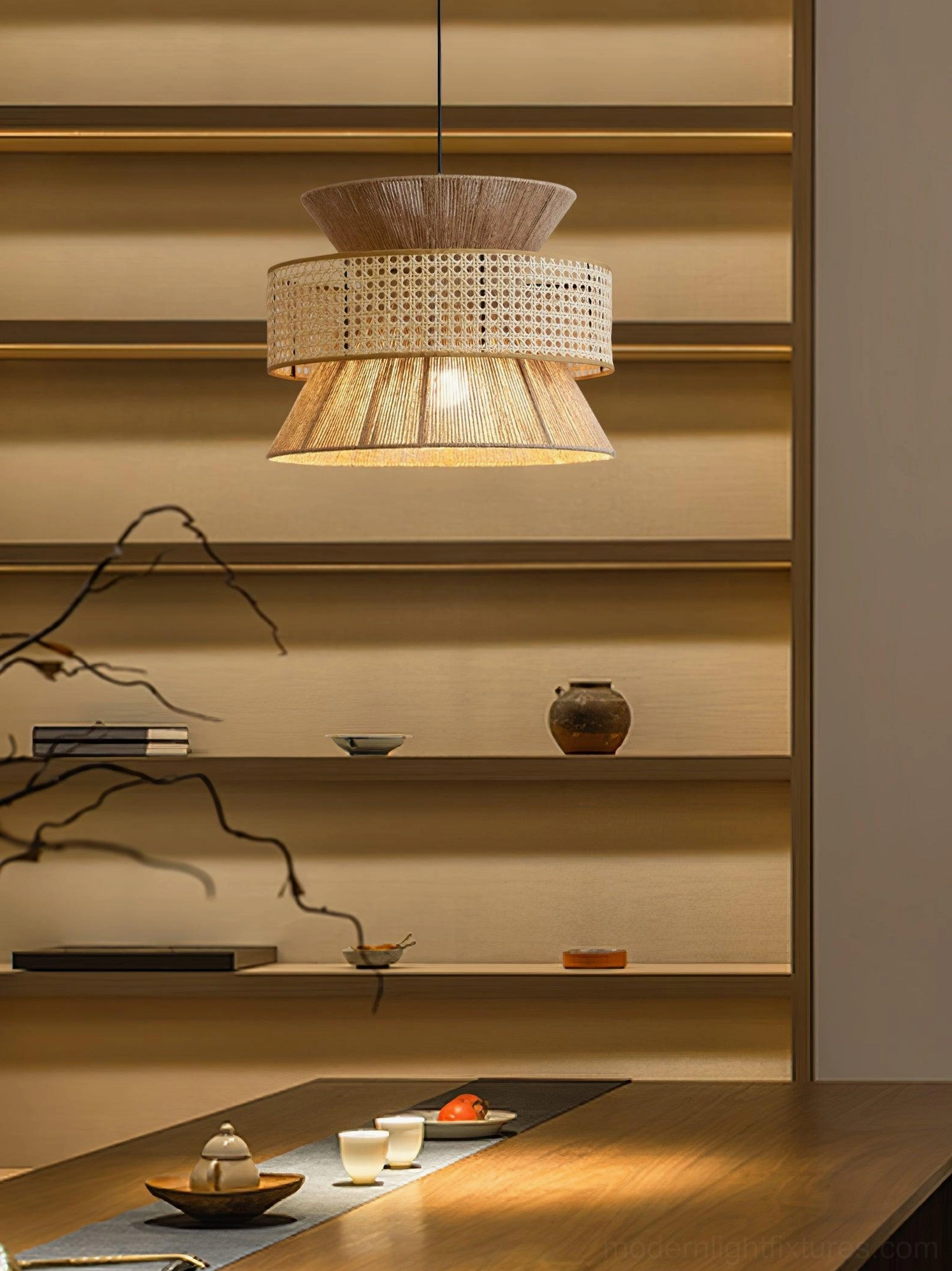 Rattan pendant light with black bamboo frame creating striking contrast with natural weaving