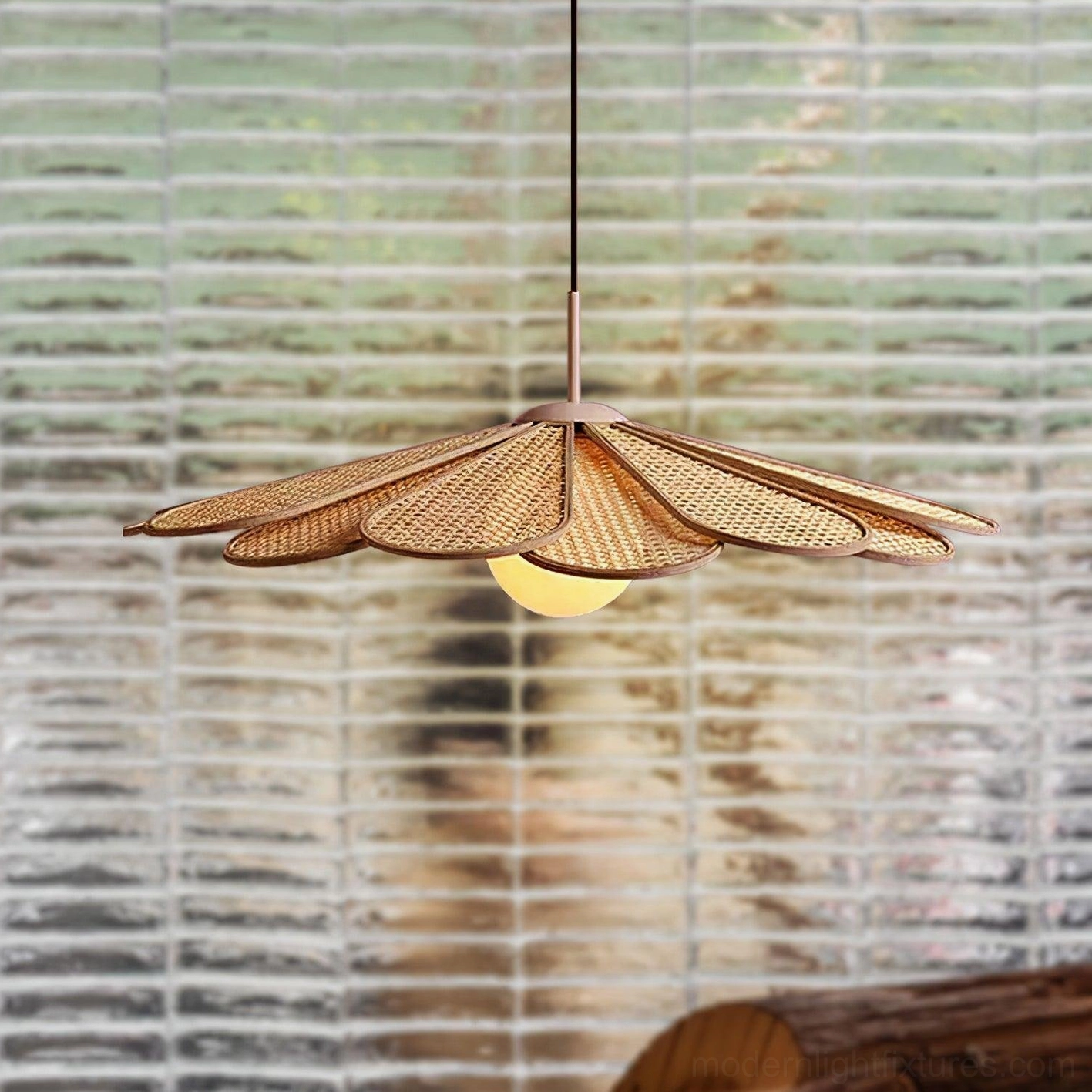 Close-up detail of Tropicana rattan pendant showing woven texture and central glass bulb holder