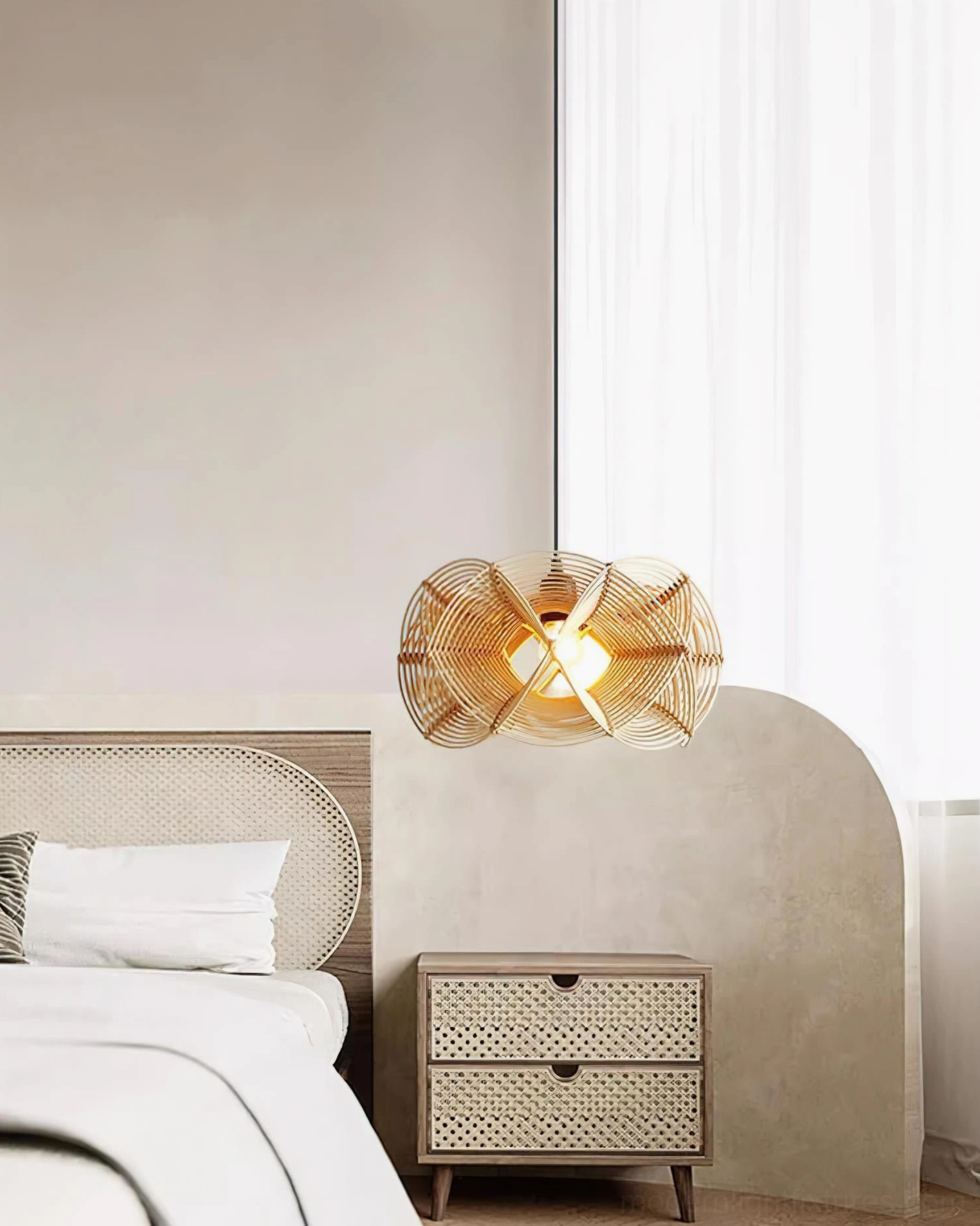 Natural woven rattan pendant light at low angle showing intricate weave texture and warm illumination quality