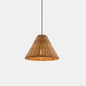 Natural rattan woven pendant light hanging in studio, conical dome shape with warm honey-brown color, boho coastal lighting fixture