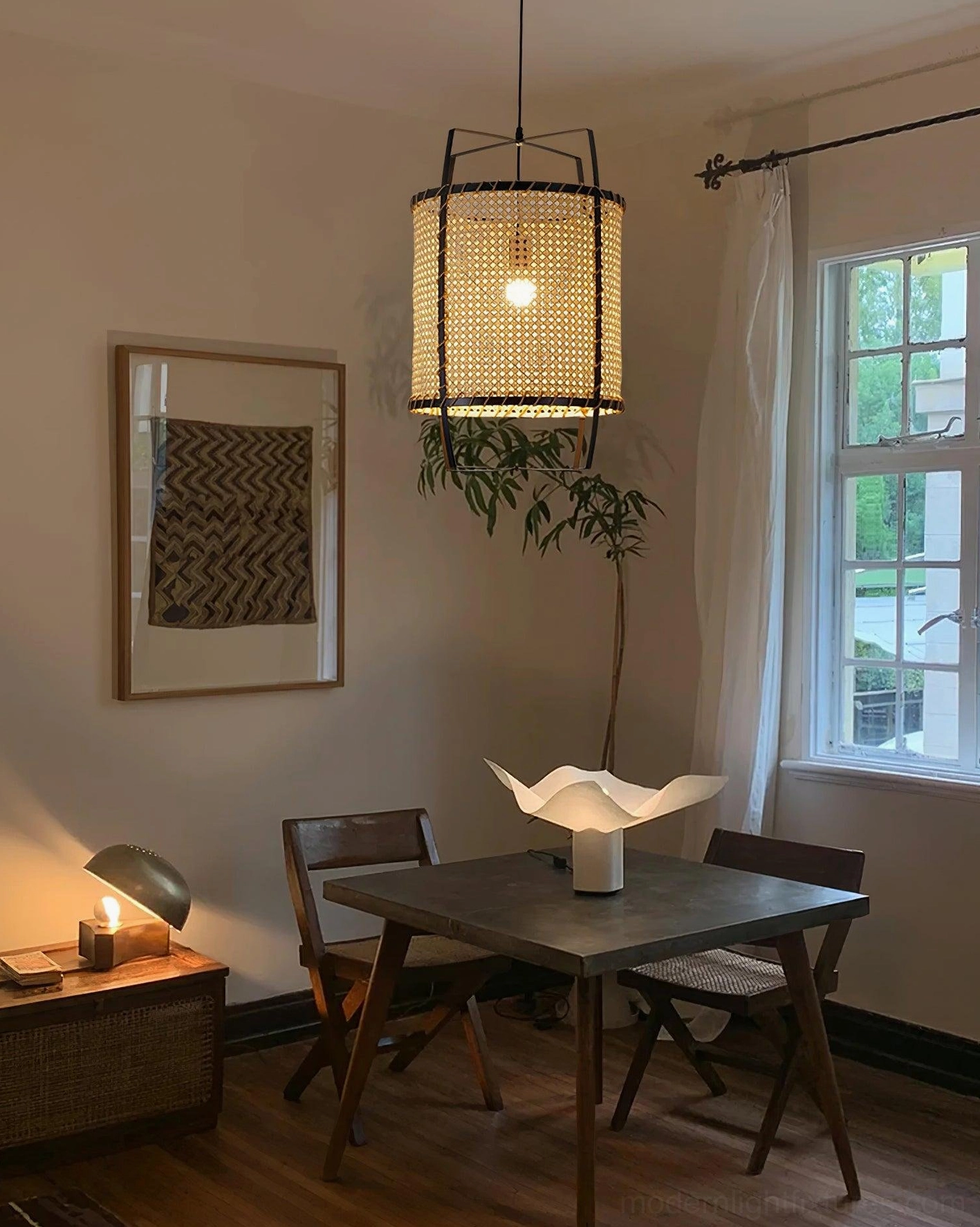 Boho rattan pendant lamp creating warm ambiance in cozy residential dining room