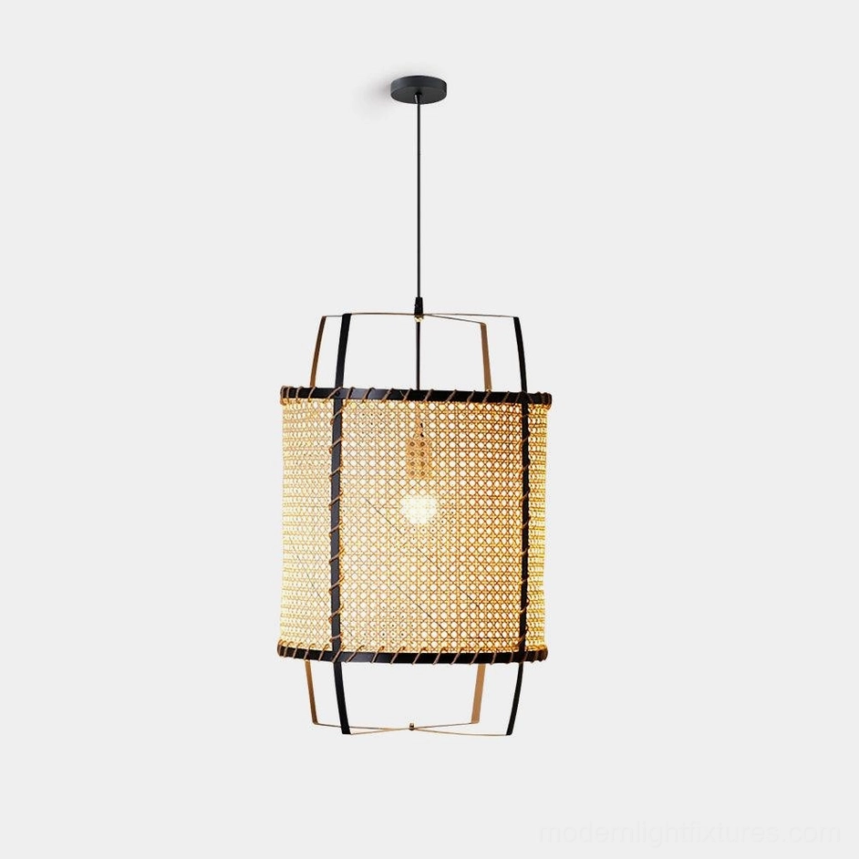 Handwoven cylindrical rattan pendant light with black metal frame, studio front view on white background