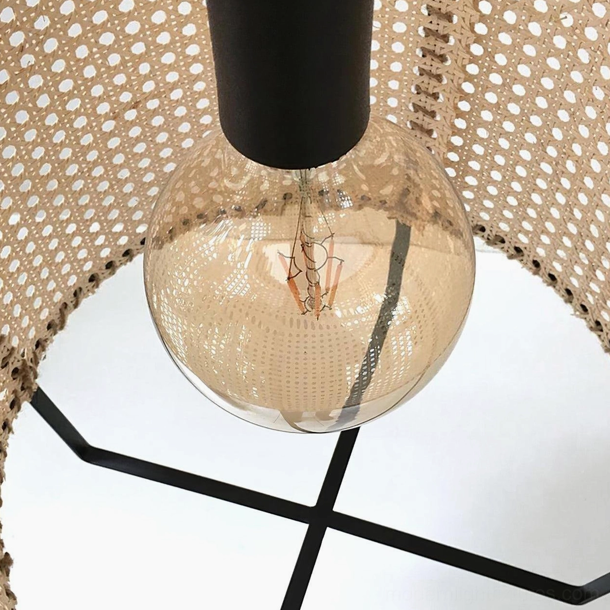 Rattan pendant light paired with dining room decor and warm lighting ambiance