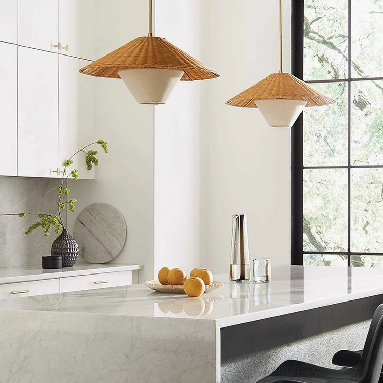 White fabric inner diffuser of rattan pendant lamp visible from below, showing light distribution quality and warm illumination effect