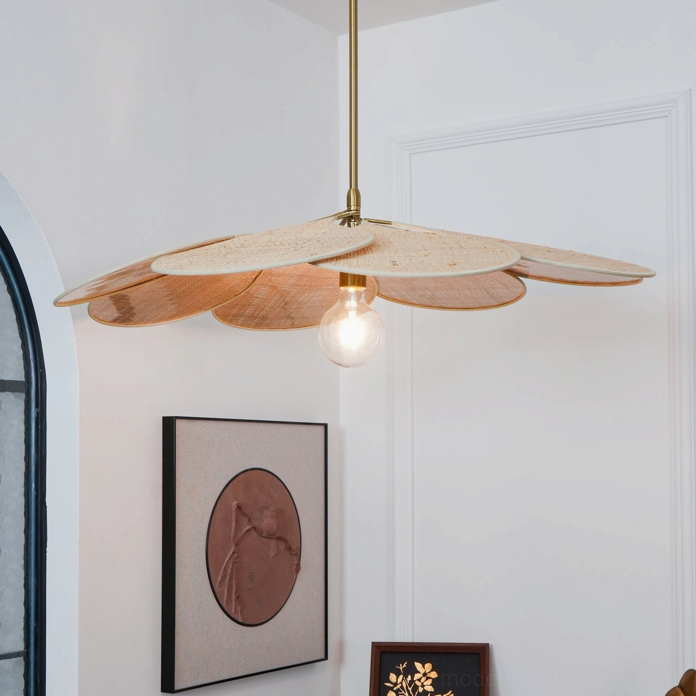 Rattan pendant light fixture showing gold suspension rod and petal arrangement in interior