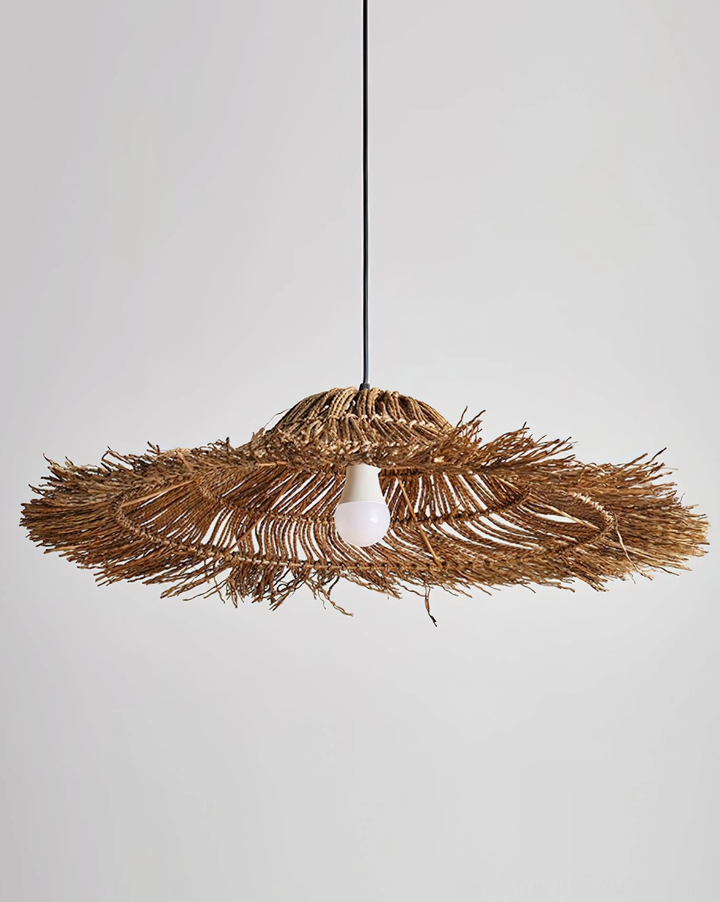 Rattan pendant light installation details showing metal hardware, electrical connection, and woven shade attachment point