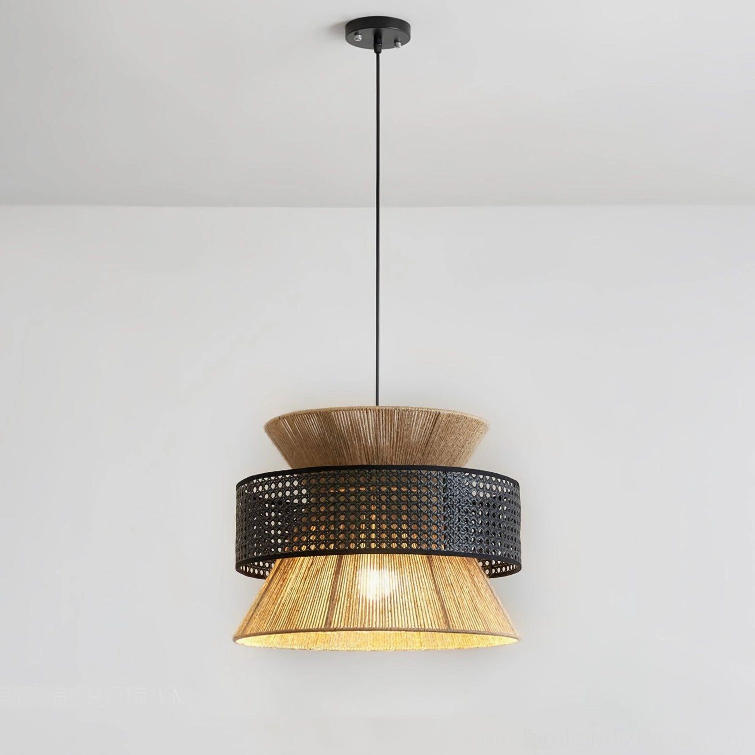 Natural rattan pendant light in living room reading nook creating intimate warm atmosphere