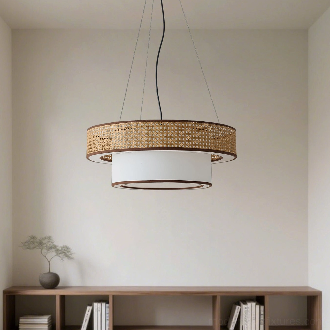 Boho rattan chandelier installed in minimalist living room with Japandi interior design, demonstrating warm ambient lighting and natural material aesthetic