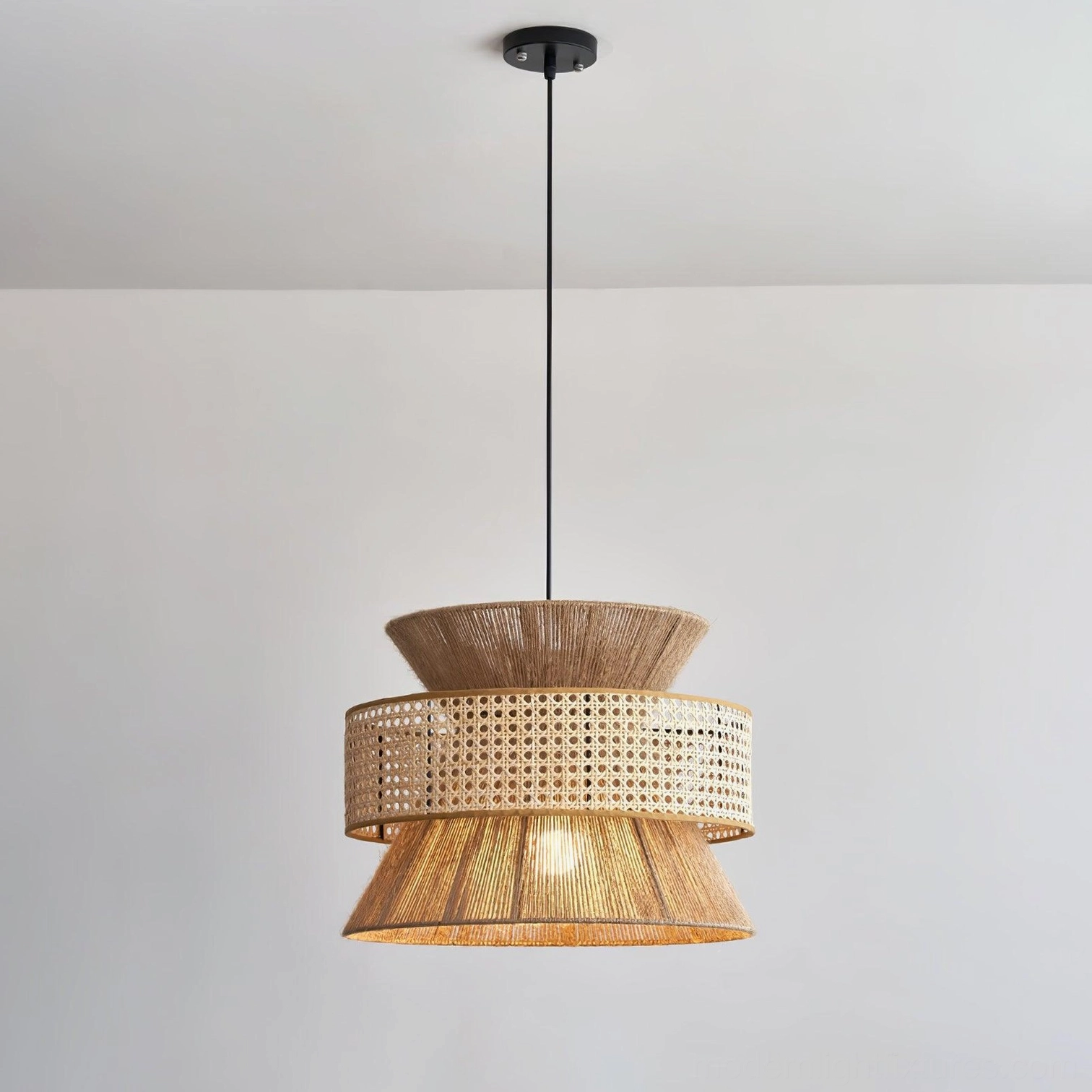 Rattan pendant light in natural finish showcasing organic color variation and material authenticity